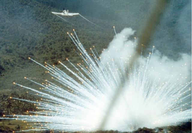 A U.S. Air Force plane drops a white phosphorus bomb on Vietnam in 1966.