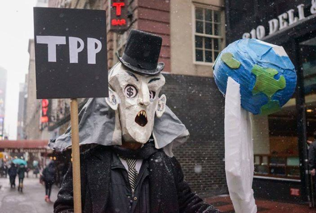 Protest at TPP negotiations in New York on January 26. (Photo by Cindy Trinh; puppet by Elliot Crown)