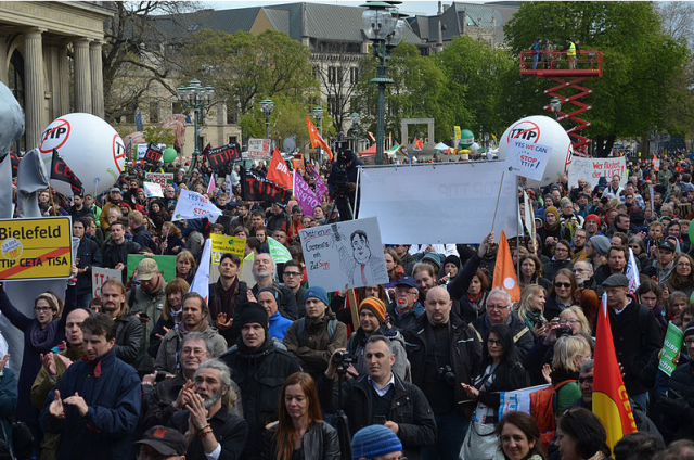 Germans protest against the TTIP in Hannover on April 23 as German Chancellor Angela Merkel and U.S. President Barack Obama confer (photo by Bernd Schwabe in Hannover)